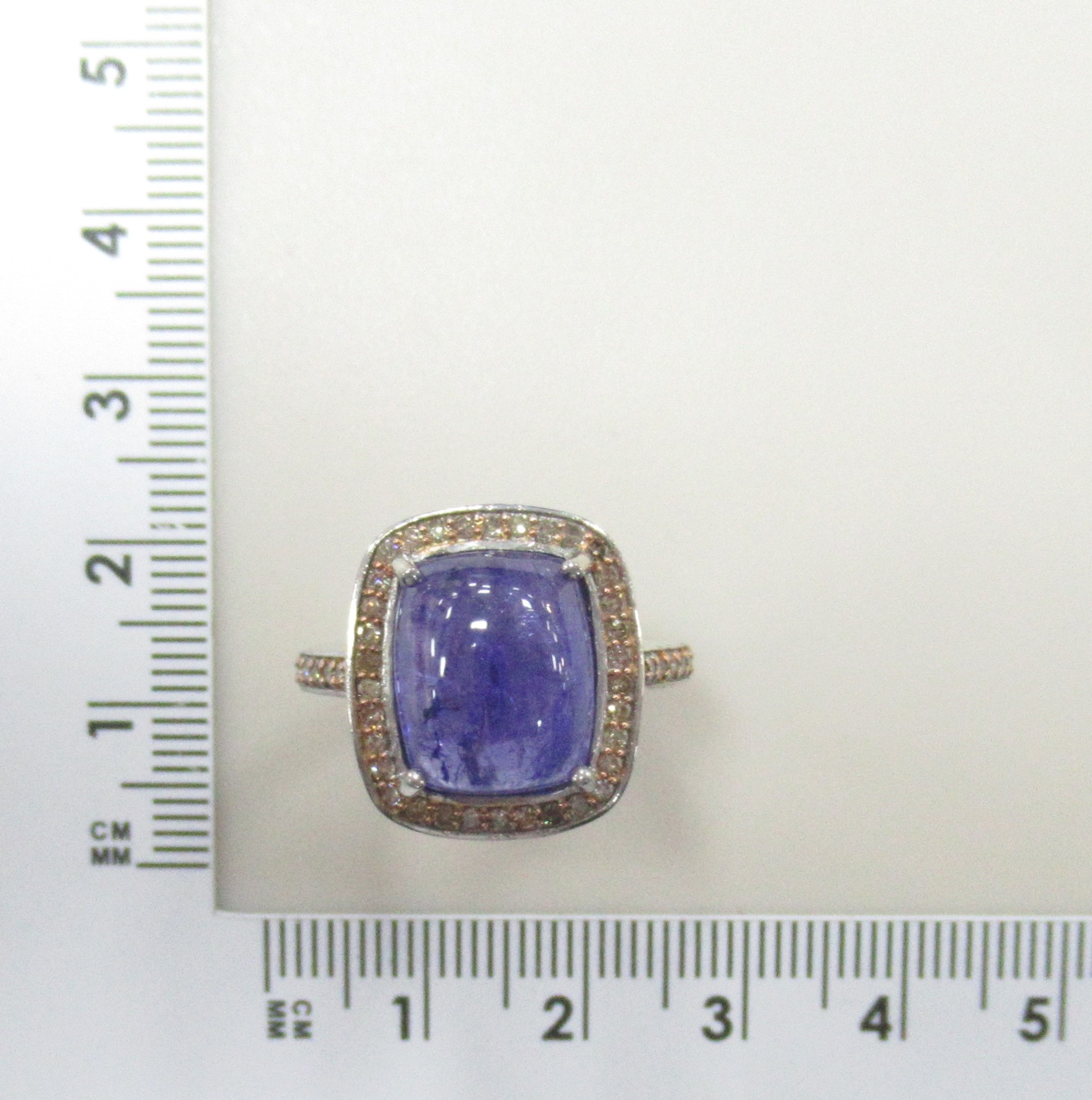 Серебряное кольцо 925 пробы; с эл. золочения; вставки 1 Танзанит 8,18ct; 48 Бр.коньяч.Кр-17 0,41ct 4/4;